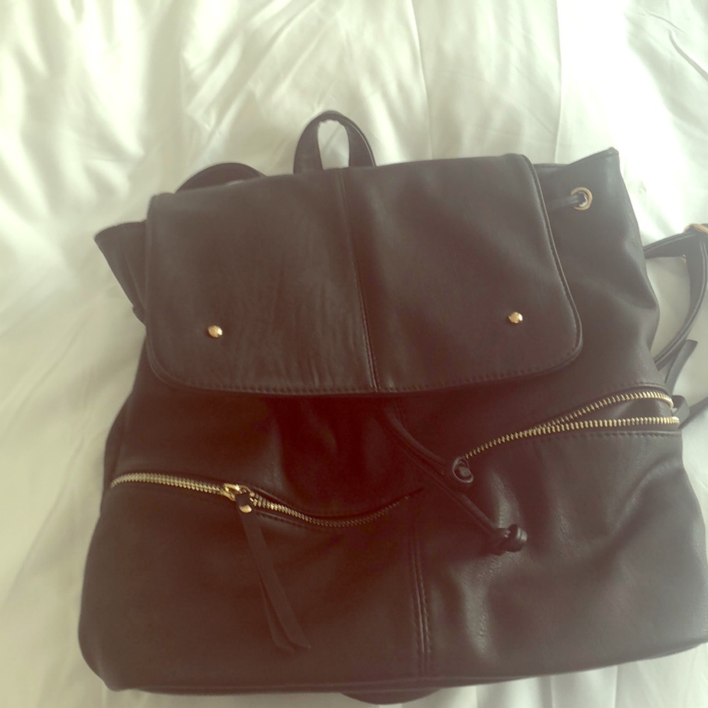 Like new, faux leather backpack, gold hardware
